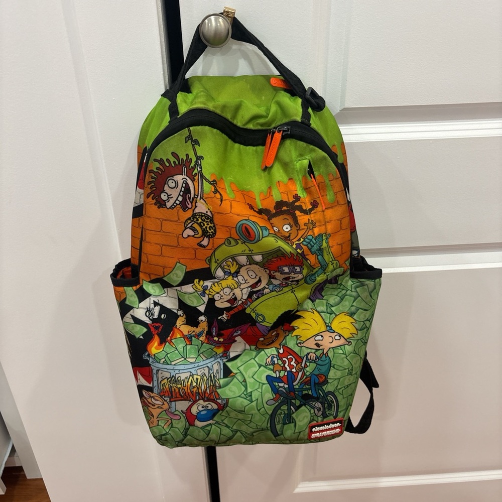 Sprayground Green and Orange Cartoon Backpack